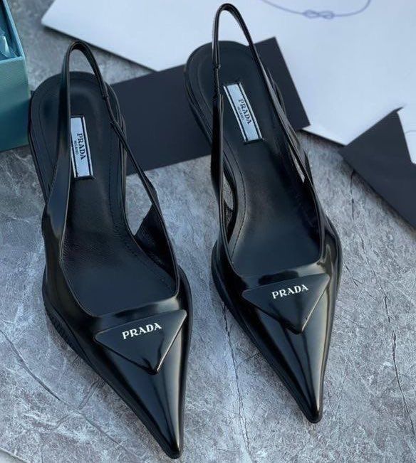 Black pointed-toe Prada pump with triangle detail