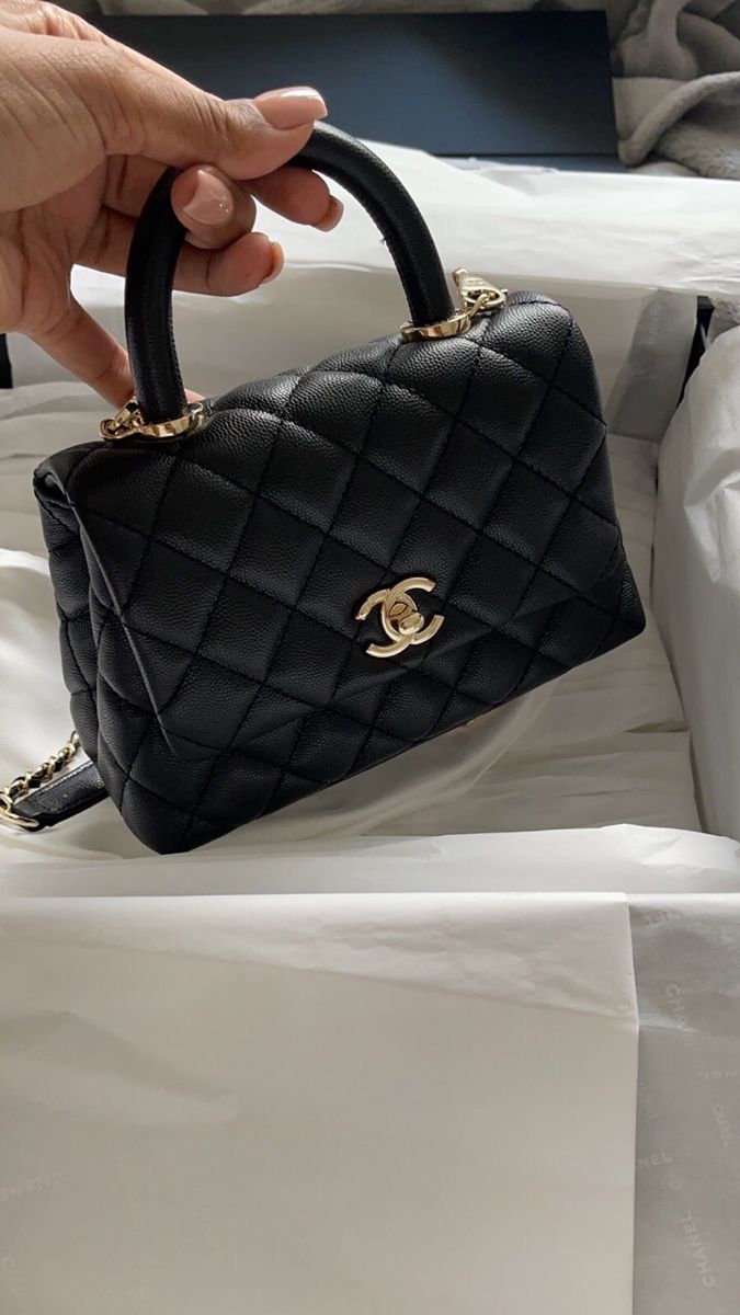 Black quilted Chanel handbag with gold hardware